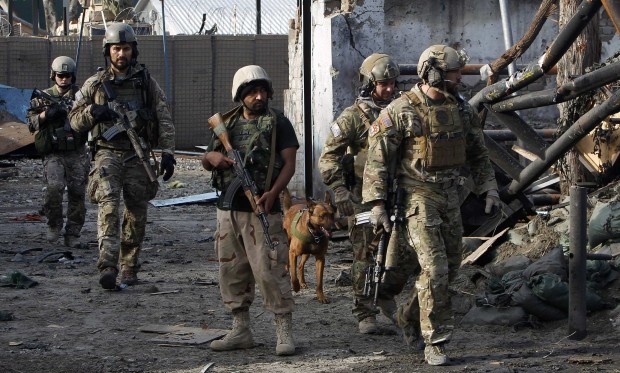 NATO and Afghan troops arrive at the site of a suicide attack in Jalalabad March 26, 2013.(REUTERS/Parwiz)