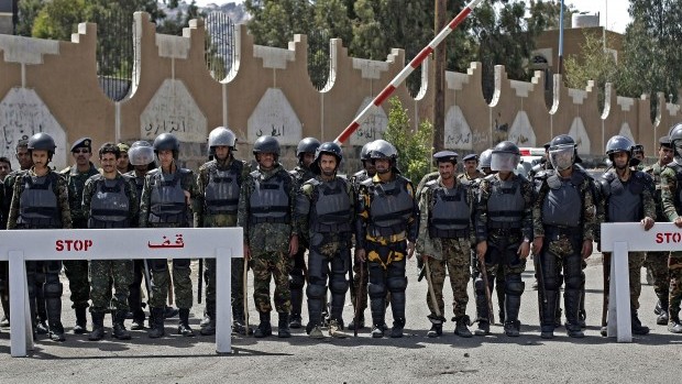 Yemeni soldiers stand guard during a demonstration in front of US embassy in Sana'a, Yemen, on Monday, April 1, 2013. (AP Photo/Hani Mohammed)