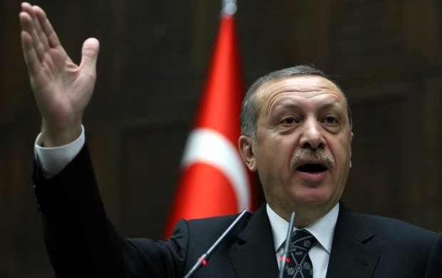 Turkish prime minister Recep Tayyip Erdoğan addresses members of his ruling Justice and Development Party (AKP) at the Turkish Parliament in Ankara on April 16, 2013. (AFP PHOTO / ADEM ALTAN)