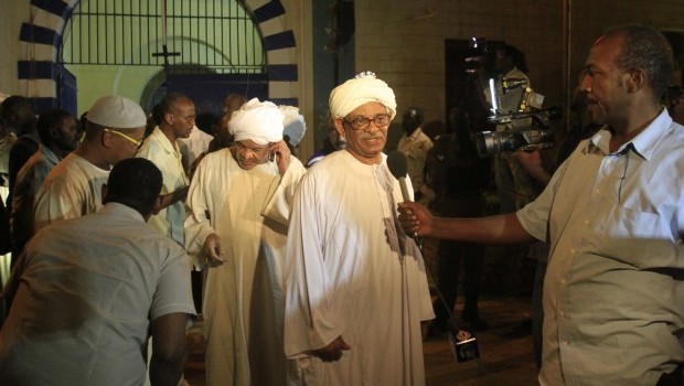 Political prisoners from Kober prison in the Sudanese capital, Khartoum, speak to the press following their release in the early hours of April 2, 2013. AFP PHOTO/ASHRAF SHAZLY