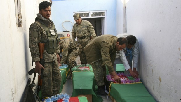 Afghan Army soldiers prepare coffins for their dead comrades in the morgue of the main hospital in Ghazni, Afghanistan, Wednesday, April 17, 2013. Source: AP Photo/Rahmatullah Nikzad