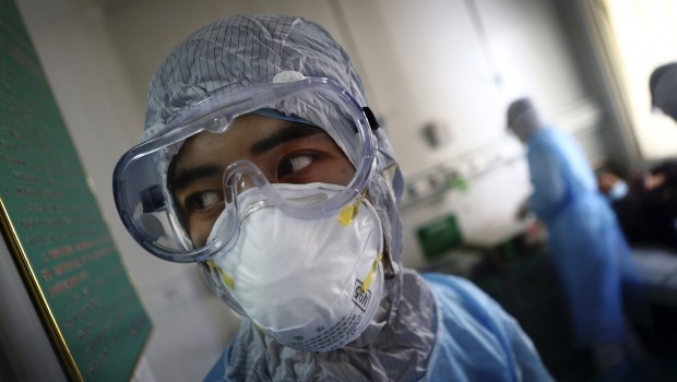 Medical staff practice dealing with an H7N9 bird flu in an emergency drill at a hospital in Zibo in east China's Shandong province (AP Photo)