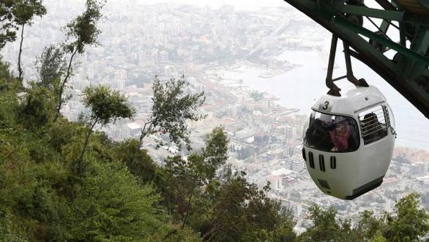 Tourists sit in a cable car from Harisa into Jounieh in northern Beirut on April 18, 2013. (REUTERS/Jamal Saidi)