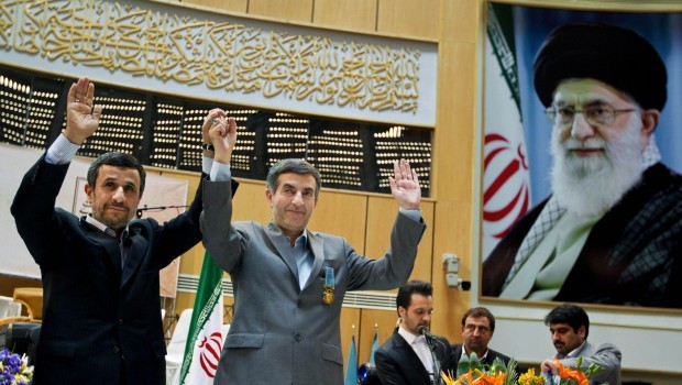 In this March 10, 2013 photo, Iranian President Mahmoud Ahmadinejad, left, holds hands with chief of staff Esfandiari Rahim Mashaei, during a press conference in Tehran, Iran. Source: AP Photo/Fars News Agency/Mohammad Hassanzadeh