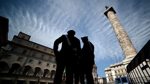 Carabinieri patrol Chigi Square by Italian Prime minister offices in Rome on April 29, 2013 the day after a Carabiniere police officer was shot by an apparently disturbed man while the country's new ministers were being sworn in. Source: AFP Photo/Filippo Monteforte