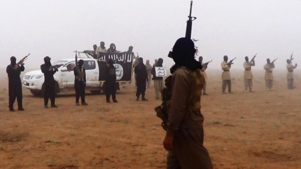 An undated image shows militants in the Al-Jazeera region on the Iraqi side of the Syria-Iraq border, Soure: AP Photo