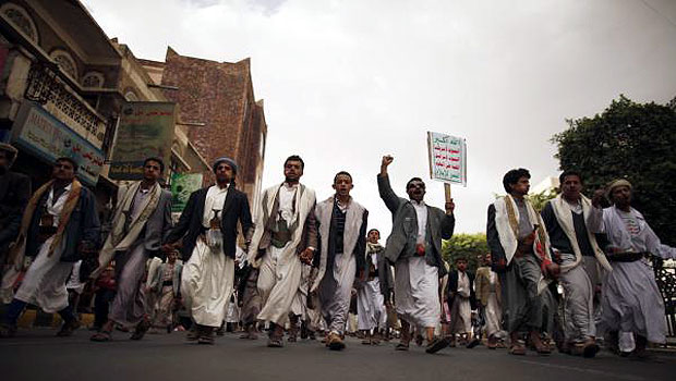 Supporters of Shi'ite al-Houthi rebel group shout slogans during demonstration against military shake-up carried out by Yemen's President Hadi, in Sanaa. (R)