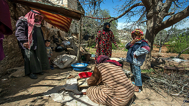 A Syrian family living in the hills of Idlib. (Asharq Al-Awsat Photo)