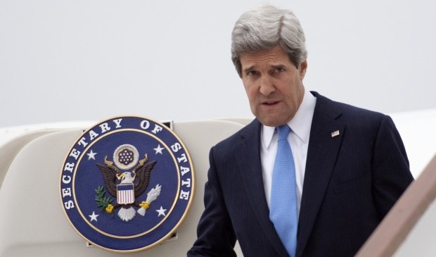 US Secretary of State John Kerry exits his goverment aircraft as he arrives at Stansted Airport near London on April 9, 2013 ahead of the G8 foreign ministers meeting and talks with the Syrian opposition. Source: AFP Photo/Pool/Paul J. Richards