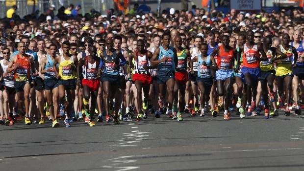 Competitors cross the start line at the beginning of the London Marathon in Greenwich, southeast London, on April 21, 2013. Runners at the London Marathon will wear black ribbons and observe a 30-second silence to honour the victims of the Boston Marathon bombings, under the watchful eyes of increased numbers of police deployed to reassure the public. (REUTERS/Eddie Keogh)