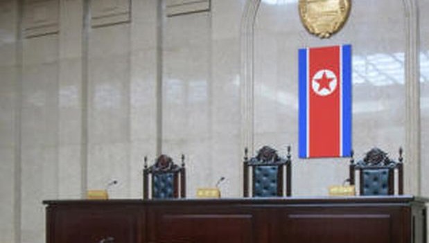 In this March 20, 2013 photo, a North Korean flag hangs inside the interior of Pyongyang’s Supreme Court. (AP PHOTO)