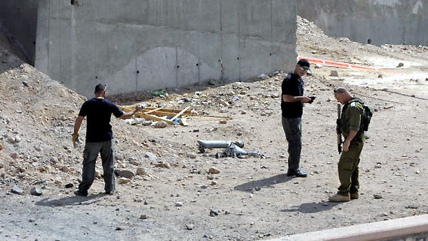 Israeli security investigates the scene of a rocket attack in Eilat, Israel, Wednesday, April 17, 2013. (AP)