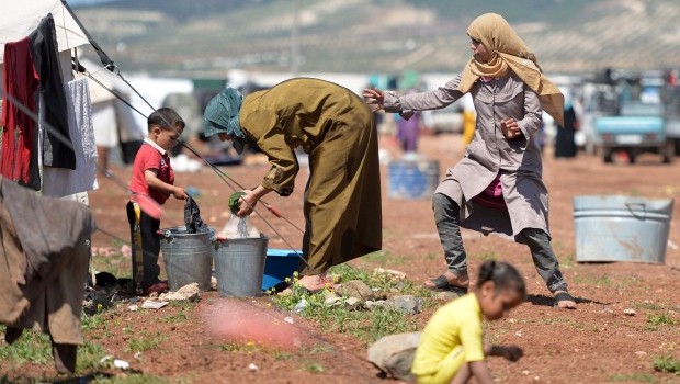 Internally displaced Syrian families spend their day at the Maiber al-Salam refugee camp along the Turkish border in the northern province of Aleppo on April 28, 2013 (AFP PHOTO / MIGUEL MEDINA)