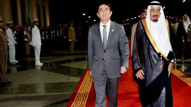 Saudi Arabia's Crown Prince Salman bin Abdulaziz Al Saud, right, escorts Japanese Prime Minister Shinzo Abe, second right, upon his arrival in Jeddah, Saudi Arabia, on Wednesday, May 1, 2013. (AP Photo)