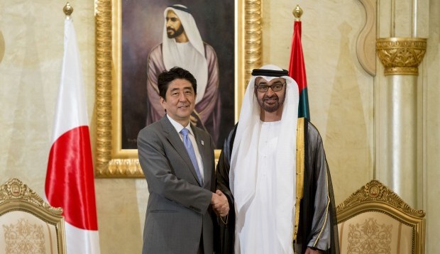 In this photo taken Wednesday, May 1, 2013 and released by the Emirates News Agency, WAM, Japanese Prime Minister Shinzo Abe, left, shakes hands with Crown Prince of Abu Dhabi and Deputy Supreme Commander of the UAE Armed Forces Sheikh Mohamed bin Zayed Al Nahyan in Abu Dhabi, United Arab Emirates. Abe vowed Wednesday to promote exports of Japan's nuclear infrastructure to the Middle East as an effort to enhance economic ties with the region. (AP Photo/Emirates News Agency, WAM)