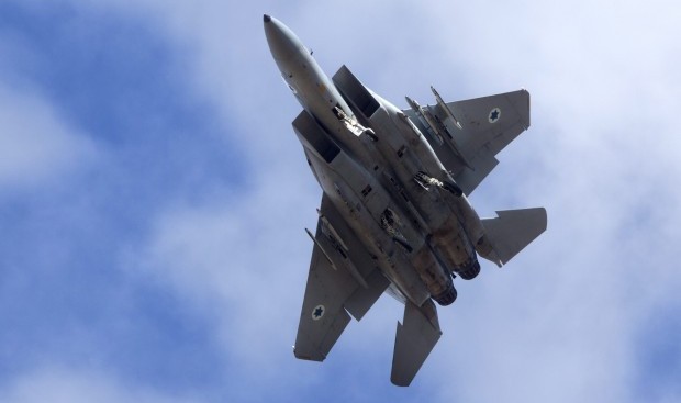 A file picture dated 04 November 2012 shows an Israeli F-15 jet fighter as it lowers its landing gear to come in for landing at an air force base in southern Israel. (EPA/JIM HOLLANDER)