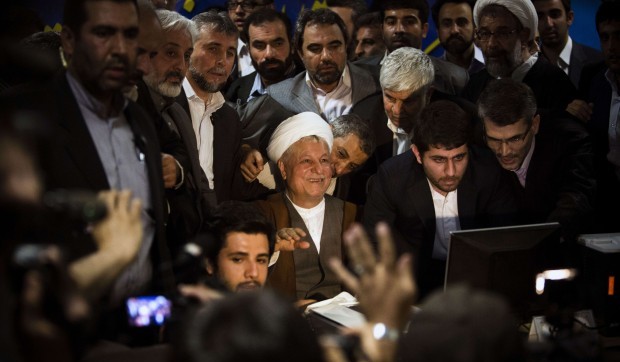 Former Iranian president Akbar Hashemi Rafsanjani (C) registers his candidacy for the upcoming presidential election at the interior ministry in Tehran on May 11, 2013. (AFP PHOTO/BEHROUZ MEHRI)