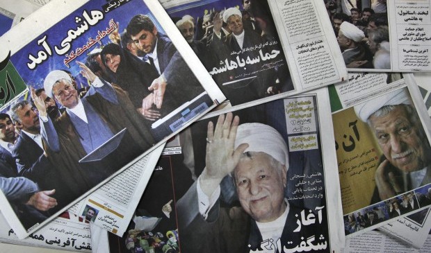 The front pages of the Sunday edition of Iranian newspapers, published with pictures of former President Akbar Hashemi Rafsanjani, a hopeful for the upcoming presidential election, are seen on Sunday, May 12, 2013. (AP Photo/Vahid Salemi)