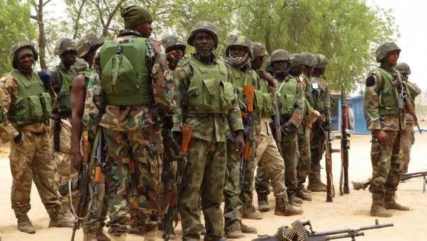 Nigerian Soldiers stand during a parade in Baga village on the outskirts of Maiduguri, in the north-eastern state of Borno May 13, 2013 (REUTERS/Tim Cocks)