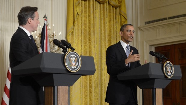 US President Barack Obama (R) and Prime Minister David Cameron (L) of the United Kingdom hold a joint news conference following their bilateral meeting, in the East Room of the White House, in Washington, DC, on May 13, 2013. (EPA/MICHAEL REYNOLDS)