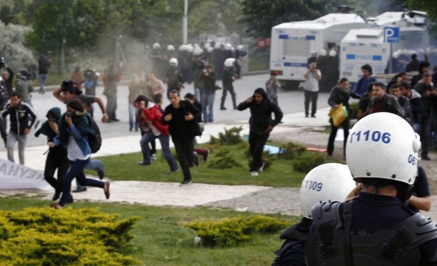 Turkish university students, who were protesting the explosions that killed tens of people in Reyhanli near the border with Syria last week, clashed with riot police at the Middle East Technical University in Ankara, Turkey, Wednesday, May 15, 2013.(AP Photo)