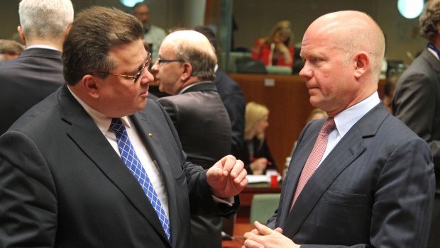 British Foreign Secretary William Hague, right, listens to Lithuania's Foreign Minister Linas Linkevicius, during the EU foreign ministers meeting, at the European Council building in Brussels, Monday, May 27, 2013. The European Union nations remain divided on Monday whether to ease sanctions against Syria to allow for weapons shipments to rebels fighting the regime of Syria's President Bashar Assad. (AP Photo/Yves Logghe)
