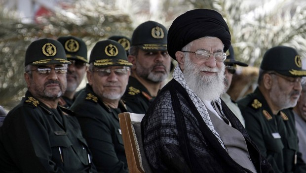 In this photo released by the official website of the Iranian supreme leader's office, supreme leader Ayatollah Ali Khamenei, foreground right, attends a graduation ceremony of a group of Revolutionary Guard members, in Tehran, Iran, Monday, May 27, 2013. (AP Photo/Office of the Supreme Leader)