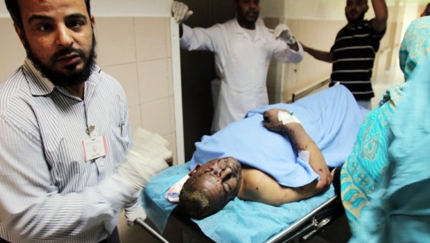 An man injured by a car bomb that exploded in the parking lot of a Benghazi hospital is rushed for treatment on May 13, 2013. AFP PHOTO/ABDULLAH DOMA