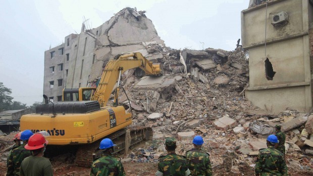Rescue workers attempt to rescue garment workers from the rubble of the collapsed Rana Plaza building in Savar, 30 km outside Dhaka April 30, 2013.