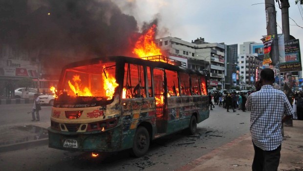 A bus burns after it was set on fire by opposition protestors ahead of nationwide general strike Wednesday and Thursday by an 18-party opposition alliance to protest what it alleges killing of Islamic activists during a blasphemy protest in Dhaka, Bangladesh, Tuesday, May 7, 2013. Source: AP Photo