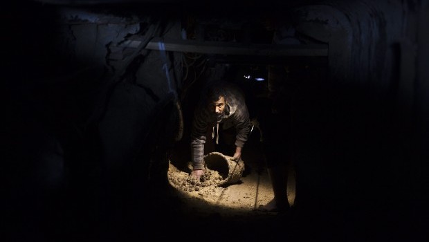 A Palestinian cleans a smuggling tunnel in the Gaza Strip, 19 February 2013 after Egyptian authorities pumped wastewater into the tunnels running under the border in a campaign to stop smuggling into the Gaza Strip. Source: EPA