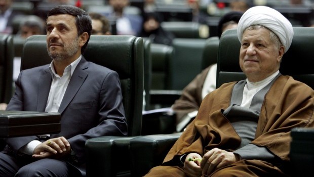 In this Sunday, May 27, 2012, file photo, former Iranian President Akbar Hashemi Rafsanjani, right, smiles, as he sits next to President Mahmoud Ahmadinejad, in an inauguration ceremony of the parliament in Tehran, Iran (AP Photo/Vahid Salemi, File)
