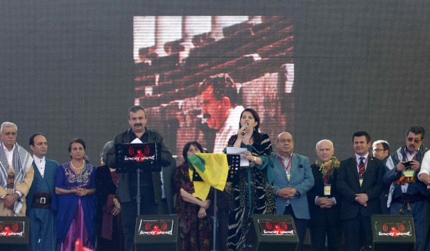 Pro-Kurdish politicians Sirri Sureyya Onder (3rd L) and Pervin Buldan (6th R) read the statement of jailed Kurdish rebel leader Abdullah Ocalan during a gathering to celebrate Newroz in the southeastern Turkish city of Diyarbakir March 21, 2013. Source: Reuters/Umit Bektas