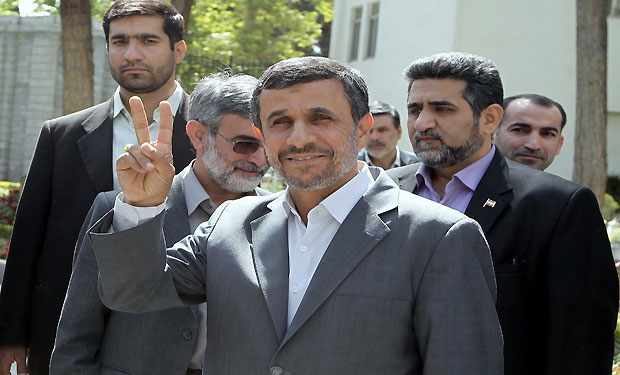  handout picture released by the Iranian presidency shows the Islamic Republic's President Mahmoud Ahmadinejad flashing the sign for victory following the weekly cabinet meeting in Tehran on May 22, 2013. (AFP)