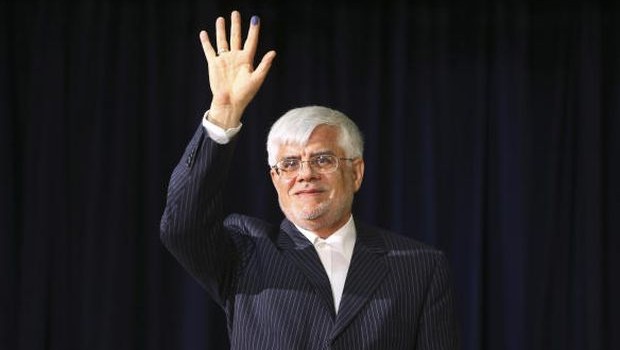 In this photo taken on Friday, May 10, 2013, pro-reform former Iranian Vice-President Mohammad Reza Aref, waves to media during his press conference, after registering his candidacy for the upcoming presidential election, at the election headquarters of the interior ministry in Tehran, Iran. (AP Photo) 