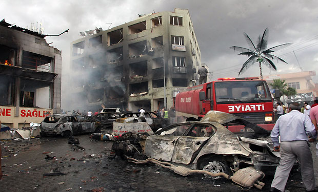 The site of one of the explosions after several explosions killed at least 40 people and injured dozens in Reyhanli, near Turkey's border with Syria, Saturday, May 11, 2013, (AP Photo/IHA) 