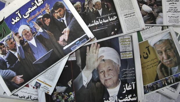 The front pages of the Sunday edition of Iranian newspapers, published with pictures of former President Akbar Hashemi Rafsanjani, a hopeful for the upcoming presidential election, are seen on Sunday, May 12, 2013. Rafsanjani made a last-minute surprise decision on Saturday to enter Iran's presidential election process. (AP Photo/Vahid Salemi)