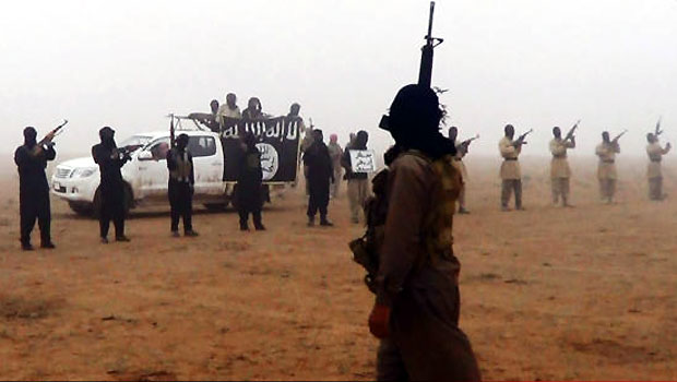 This undated image posted on a militant website purports to show militants in the al-Jazeera region on the Iraqi side of the Syria-Iraq border. (AP)