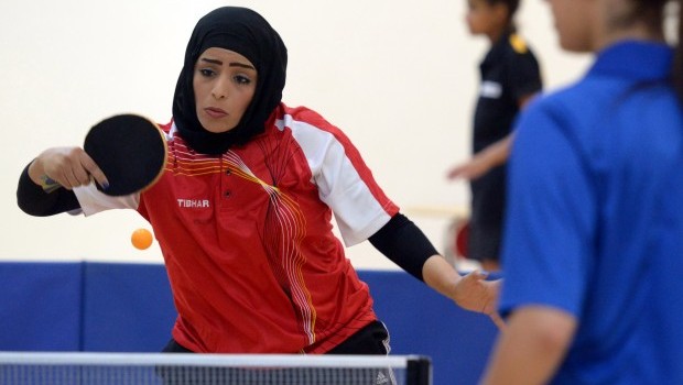 Al-Nadi Club's table tennis player Kifaya Al-Awardi plays during the Women's Games at Salwa Al-Sabah Sports Center in Qurein, Kuwait, on Thursday, May 9, 2013. The event is part of a new initiative launching sports leagues for women. (AP Photo/Gustavo Ferrari)