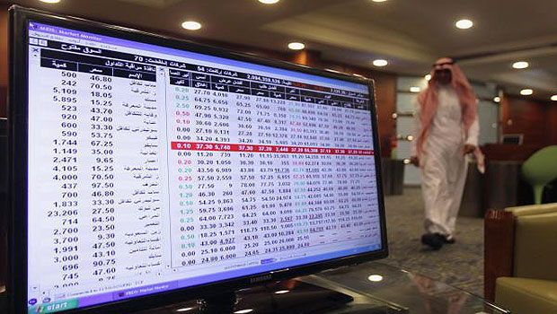 A screen displaying stock market index is seen at the Saudi stock market in Riyadh. (Reuters)