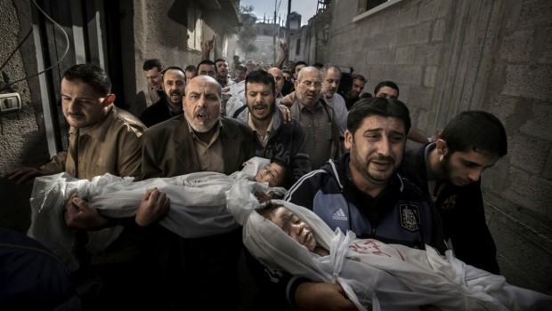 'Gaza Burial,' which won first prize in the 2013 World Press Photo awards. The 2013 World Press Photo of the year by Paul Hansen, Sweden, for Dagens Nyheter, shows 2-year-old Suhaib Hijazi and her 3-year-old brother Muhammad who were killed when their house was destroyed by an Israeli missile strike. (AP Photo/Paul Hansen, Dagens Nyheter)