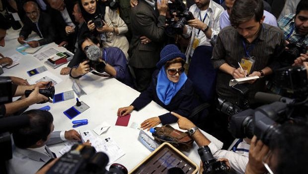 Etrat Kazemi, seated at center, registers her candidacy for the upcoming presidential election, at the election headquarters of the interior ministry in Tehran, Iran, Friday, May 10, 2013. (AP Photo)