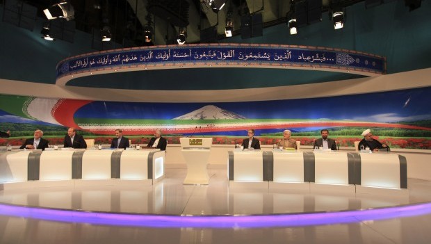 In this photo released by the Islamic Republic of Iran Broadcasting on Friday, May 31, 2013, presidential candidates from left, Mohammad Gharazi, Mohammad Bagher Qalibaf, Ali Akbar Velayati, Saeed Jalili, Gholam Ali Haddad Adel, Mohammad Reza Aref, Mohsen Rezaei, Hasan Rowhani, attend a TV debate in a state-run TV studio, in Tehran, Iran. (AP)