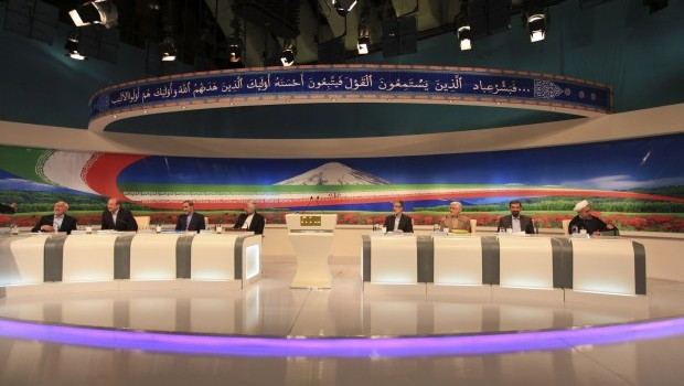 Iranian presidential candidates, from left: Mohammad Qarazi, Mohammad Baqer Qalibaf, Ali Akbar Velayati, Saeed Jalili, Gholam Ali Haddad-Adel, Mohammad Reza Aref, Mohsen Rezaei and Hasan Rouhani attend the first televised debate in Tehran, Iran on May 31, 2013. (Islamic Republic of Iran Broadcasting)