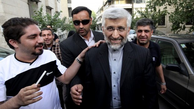 In this Wednesday, May 29, 2013 file photo, Iranian presidential candidate Saeed Jalili, center right, Iran's top nuclear negotiator, arrives at a campaign rally attended by his female supporters, in Tehran, Iran. (AP Photo/Vahid Salemi, File)