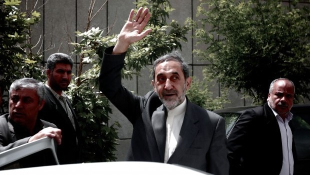 Advisor to the supreme leader Ayatollah Ali Khamenei and hopeful conservative presidential candidate, Ali Akbar Velayati (C) waves as he leaves after a campaign rally in Tehran on June 2, 2013 (AFP PHOTO/BEHROUZ MEHRI)