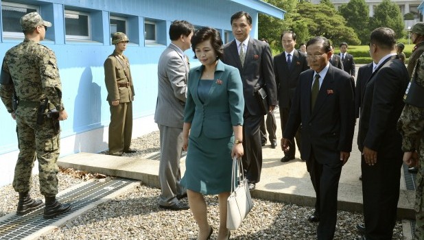 North Korean head of delegation Kim Song Hye, center, walks with other delegates after crossed a military demarcation line for the meeting with South Korea at the Panmunjom which has separated the two Koreas since the Korean War, in Paju, north of Seoul, South Korea, Sunday, June 9, 2013 (AP Photo/South Korean Unification Ministry, HO)