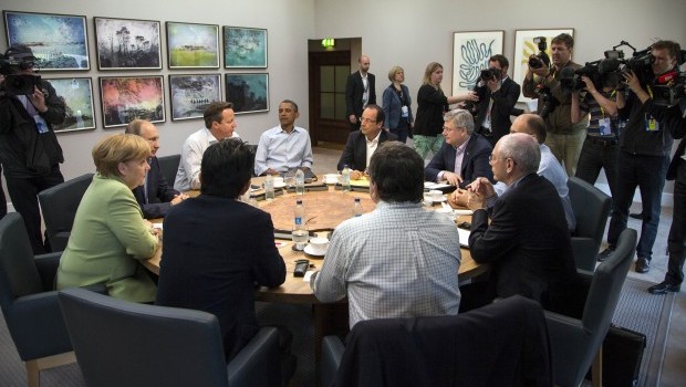 Leaders of the G8 member countries attend the second plenary work session at the G8 Summit in Lough Erne, Northern Ireland, Britain, 18 June 2013. Leaders are from left, German Chancellor Angela Merkel, Russian President Vladimir Putin, British Prime Minister David Cameron, US President Barack Obama, French President Francois Hollande, Canadian Prime Minister Stephen Harper, Italian Prime Minister Enrico Letta, European Council President Herman Van Rompuy and European Commission President Jose Manuel Barroso. (AP Photo/Ian Langsdon, Pool) 