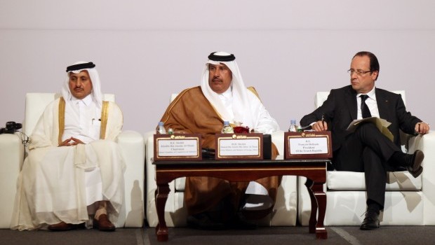 From left: Sheikh Khalifa bin Jassim bin Mohammed Al Thani, chairman of the Qatari Chamber of Commerce and Industry; Qatari Prime Minister and Foreign Minister Hamad bin Jassim Al Thani; French President Francois Hollande at the the Qatari-French Business Forum in Doha, Qatar, Sunday, June 23, 2013. (AP Photo/Osama Faisal)