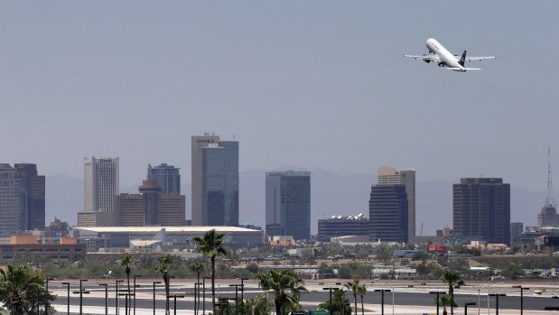 A jet takes off from Sky Harbor International Airport, Friday, June 28, 2013 in Phoenix. Airlines are monitoring the soaring temperatures to make sure it's safe to fly as excessive heat engulfs much of the Desert Southwest (AP Photo/Matt York)